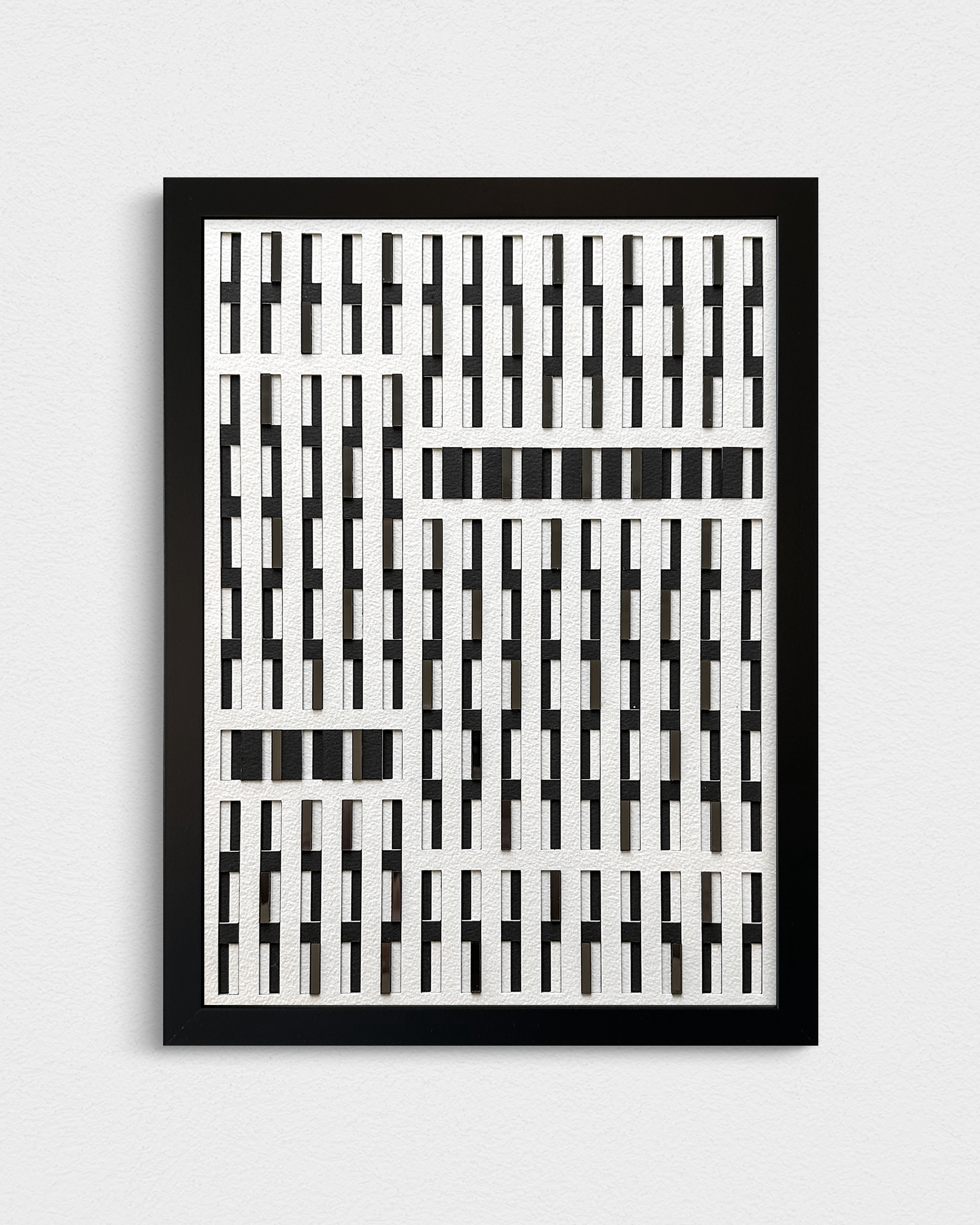 Interactive paper relief with embedded mirrors that change the composition with different light and viewer perspectives.